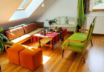 a living room with a couch and a table at Pr Trnovc in Preddvor