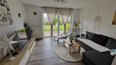 a living room with a couch and a table at Simona's place-Free private parking in Ljubljana