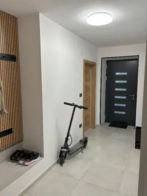 a room with a exercise bike in a room with a door at Livan Apartment in Tolmin