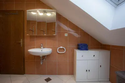 a bathroom with a sink and a mirror at Apartment Harmony Bled in Bled
