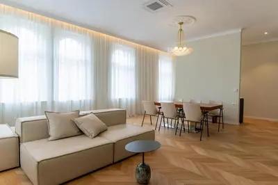 a living room with a couch and a table at Villa Elizabeth - Grand Family Apartment in Slovenj Gradec