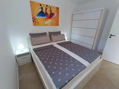 a bed in a small room with a bed frame at Apartma LANA in Koper