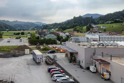 an aerial view of a town with cars parked in a parking lot at Apartment Dalgona Delux in Podčetrtek
