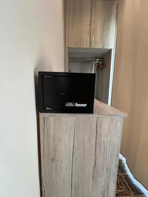 a tv sitting on top of a wooden stand at CentralPark Suites in Maribor