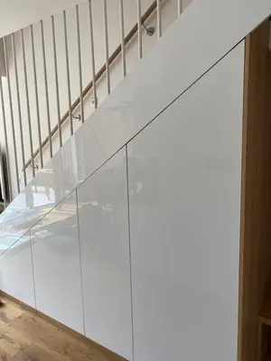 a glass wall in a room with a staircase at Apartment 1 Pearl in Bovec