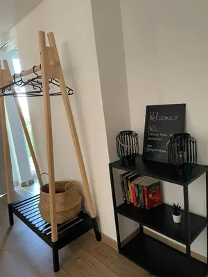 a wooden ladder in a room with two shelves at Maja's Sunrise Haven in Mala Nedelja