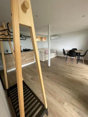 a room with a loft bed and a dining room at Maja's Sunrise Haven in Mala Nedelja