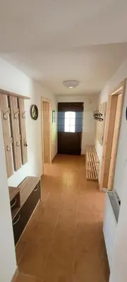 a room with a hallway with a door and a floor at Apartma Brin in Bovec