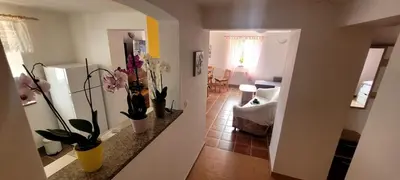 a view of a living room with flowers on a counter at Apartma Brin in Bovec