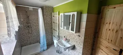 a bathroom with a sink and a shower at Apartma Brin in Bovec