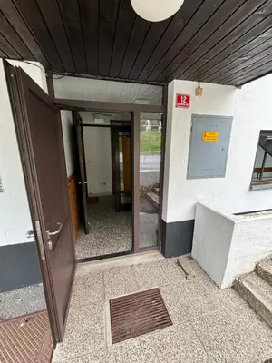 an entrance to a building with an open door at Apartma Tine in Bovec