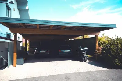 a car garage with two cars parked in it at Apartments & rooms Ksenya in Spodnja Hajdina