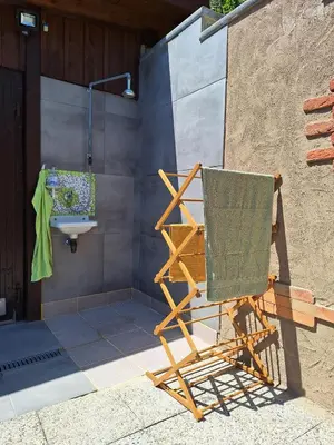 a chair and a sink in a bathroom at Štibelc FRIDA in Izlake