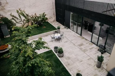 an overhead view of a patio with a table and plants at Villa Elizabeth - Mansard Apartment for 4 in Slovenj Gradec