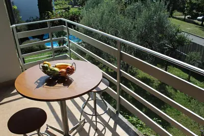 a bowl of fruit on a table on a balcony at Drift Rock House in Sežana