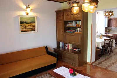 a living room with a couch and a table at Drift Rock House in Sežana
