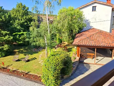 an aerial view of a garden and a house at Apartments Štrancar wines in Ajdovščina