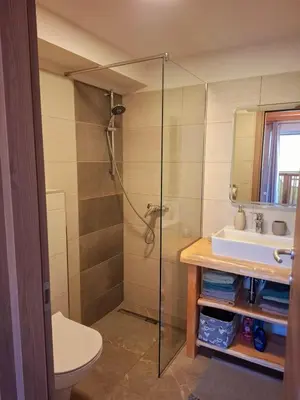 a bathroom with a shower and a sink at Apartments Štrancar wines in Ajdovščina