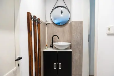 a bathroom with a sink and a mirror at Studio M&M in Nova Gorica