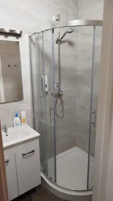 a bathroom with a shower and a sink at DEKO-LIME apartments in Ljubljana
