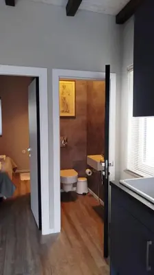 a bathroom with a toilet and a sink at DEKO-LIME apartments in Ljubljana