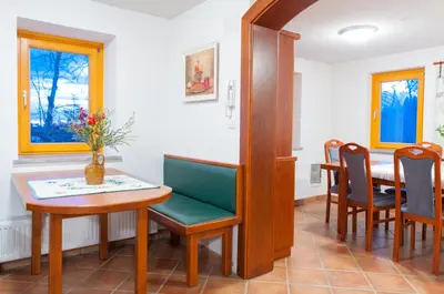 a dining room with a table and chairs at Holiday Home Zelenka in Cerklje na Gorenjskem