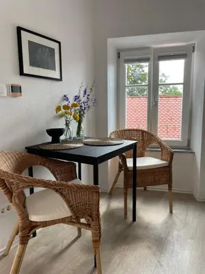 a dining room with a table and two chairs at B&B Apartment for2 in Kranj
