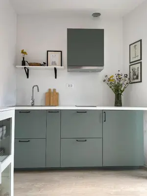 a kitchen with a sink and a tv on the wall at B&B Apartment for2 in Kranj