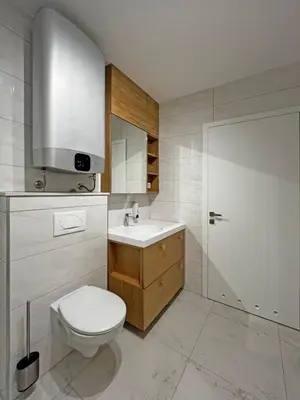 a bathroom with a toilet and a sink at Apartma 17 - Perla in Bovec