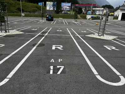 an empty parking lot with a car parked in it at Apartma 17 - Perla in Bovec