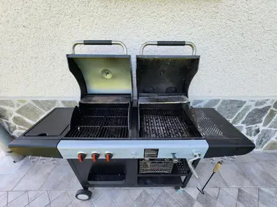 a bbq grill sitting on top of a floor at ZenHouseApartment in Ljubno