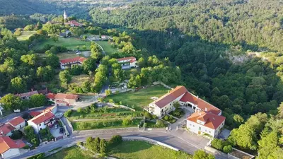 an aerial view of a house in a forest at Apartmaji Žnidarčič in Divača