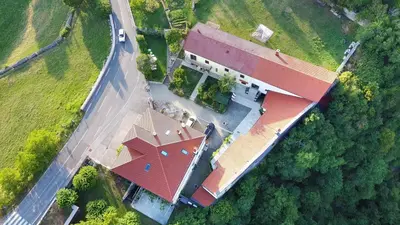an overhead view of a large building with a red roof at Apartmaji Žnidarčič in Divača