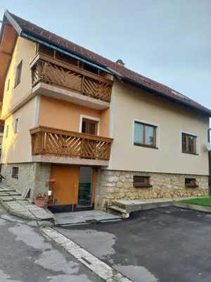 a large building with a balcony and a parking lot at Apartment ML FREE PARKING in Loče pri Poljčanah