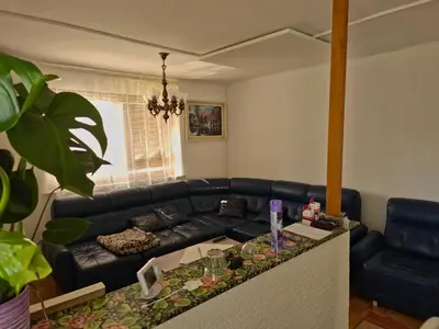 a living room with a black leather couch at Apartment ML FREE PARKING in Loče pri Poljčanah