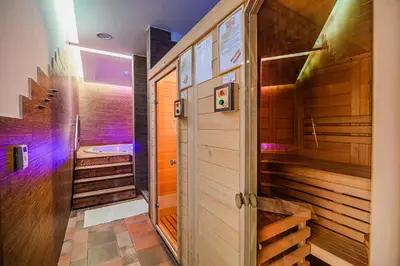 a bathroom with a tub and a walk in shower at Glamping Maleric with Natural Pool in Dragatuš