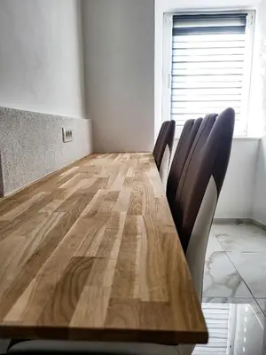 a conference room with a wooden table and chairs at Stara Pošta Apartment 7 in Grosuplje