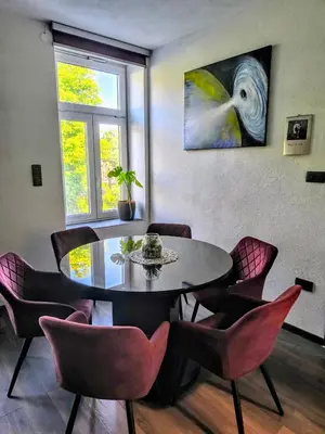 a dining room with a table and chairs at Central Ljubljana Apartment in Ljubljana