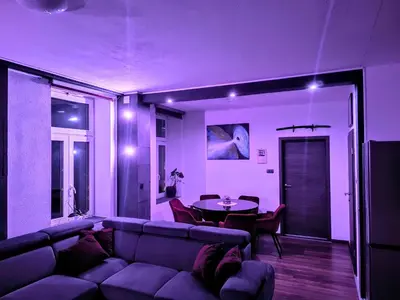a living room with a couch and a table at Central Ljubljana Apartment in Ljubljana