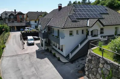 an aerial view of a house with solar panels on the roof at Apartma Matevž in Radovljica