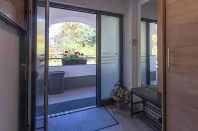 an entrance to a house with a glass door at Apartma Matevž in Radovljica