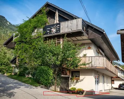 a building with a clock on the side of it at Hidden Corner in Žirovnica