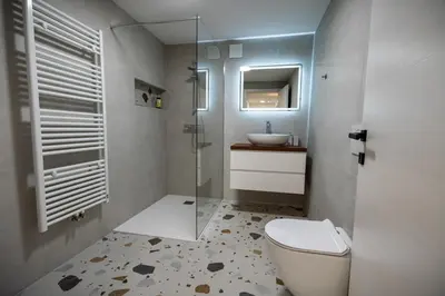 a bathroom with a toilet and a sink at Hidden Corner in Žirovnica