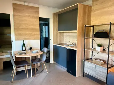 a kitchen and dining room with a table and chairs at ChillHouse in Ajdovščina