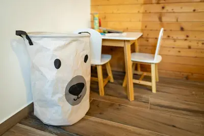 a plastic bag sitting on the floor next to a table at Apartmaji Lipa in Bohinj