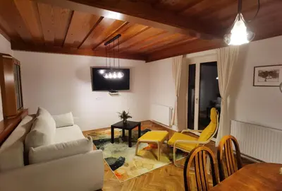 a living room with a couch and a table at Apartma Žerjav in Kranjska Gora