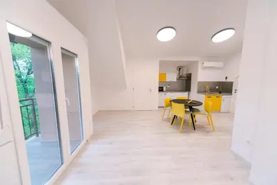 a kitchen and dining room with a table and chairs at Apartma RO-ZE in Bistrica ob Sotli
