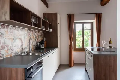 a kitchen with a sink and a window at Wellba Homestead Planina in Ajdovščina