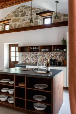 a kitchen with a counter with wine glasses at Wellba Homestead Planina in Ajdovščina