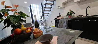 a kitchen with a table with a bowl of fruit on it at Ljubljana Nest- centre, free parking- renovated August 2024 in Ljubljana